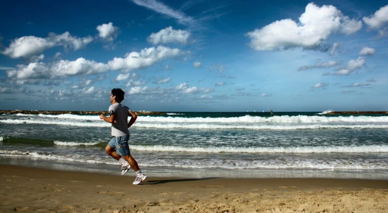 sportsman running on the beach