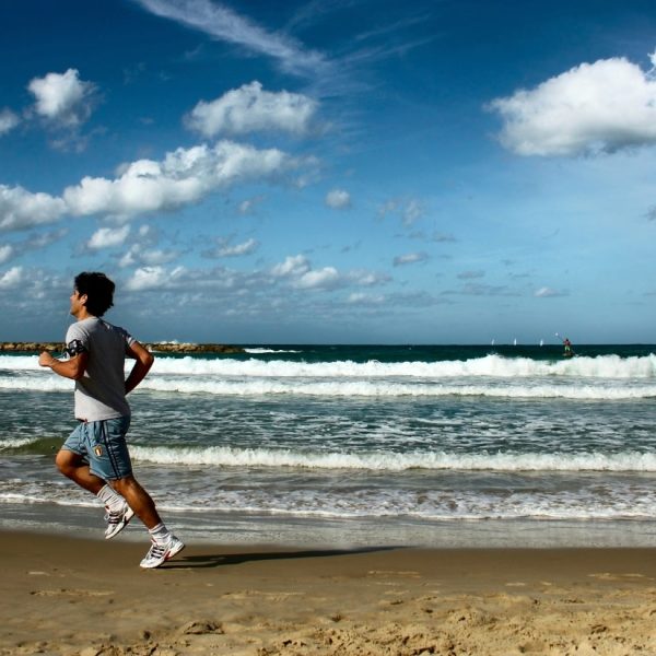 sportsman running on the beach